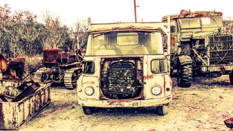 an old car in a junkyard rusted out