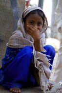 smiling girl sitting in a scarf