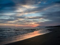 A beautiful sunset by the sea beach