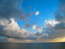 evening view of clouds by the sea