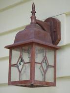 wooden lantern on a white wall