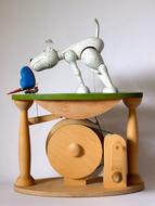 wooden toy with a dog and a butterfly