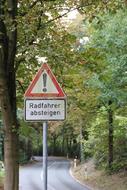 red sign in the landscape forest