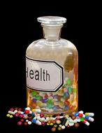 multicolored medical capsules in a transparent bottle