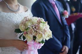 The Groom Holding Flowers