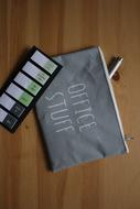 gray pencil case with bookmarks