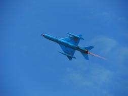blue military plane in the sky