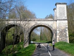 arch bridge bridge people road park