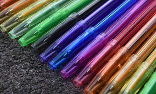 colored pens on the ground