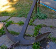 an old anchor on a stone floor