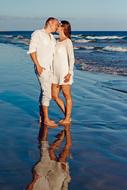 kissing couple by the sea