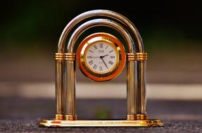 gold clock indicating the time
