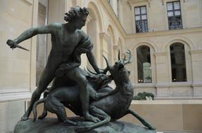 sculpture of a hunter with a deer