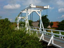 white wooden bridge over the river in Germany