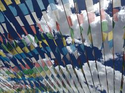 colored flags on a background of clouds