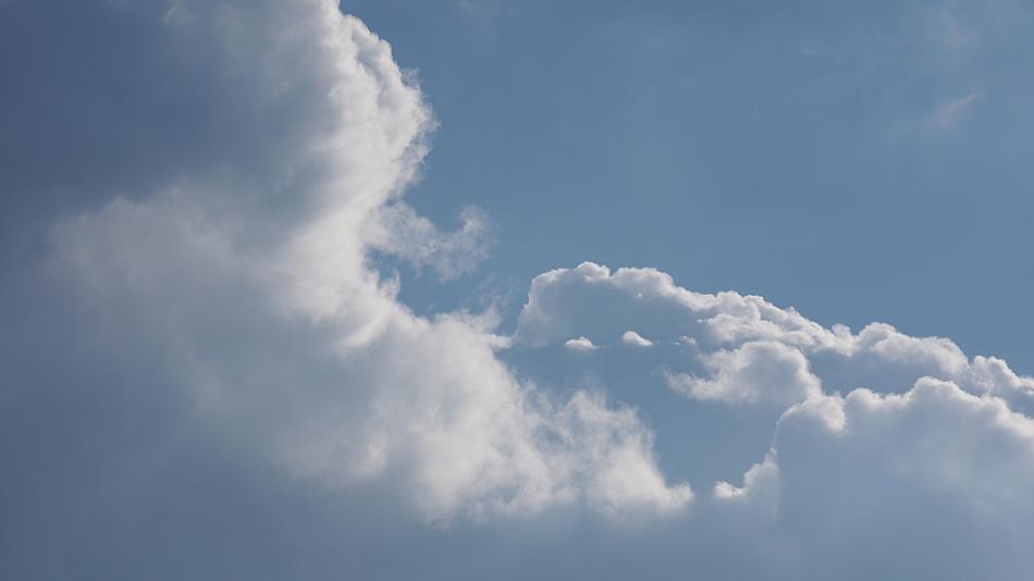 white fluffy clouds in the sky blue landscape