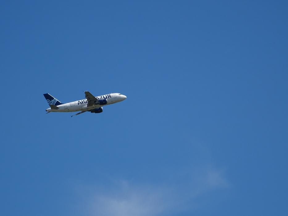 plane takes off in the blue sky