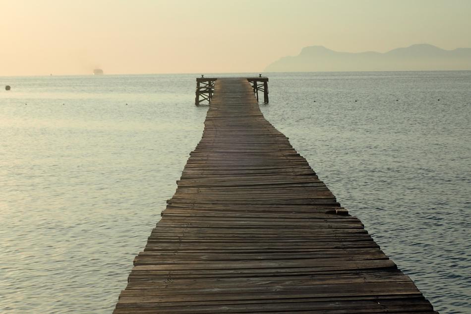 long wooden bridge into the sea