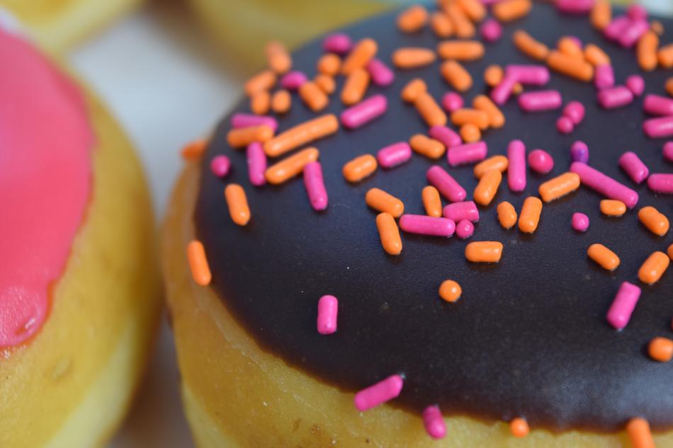 Chocolate doughnut with colored sprinkles