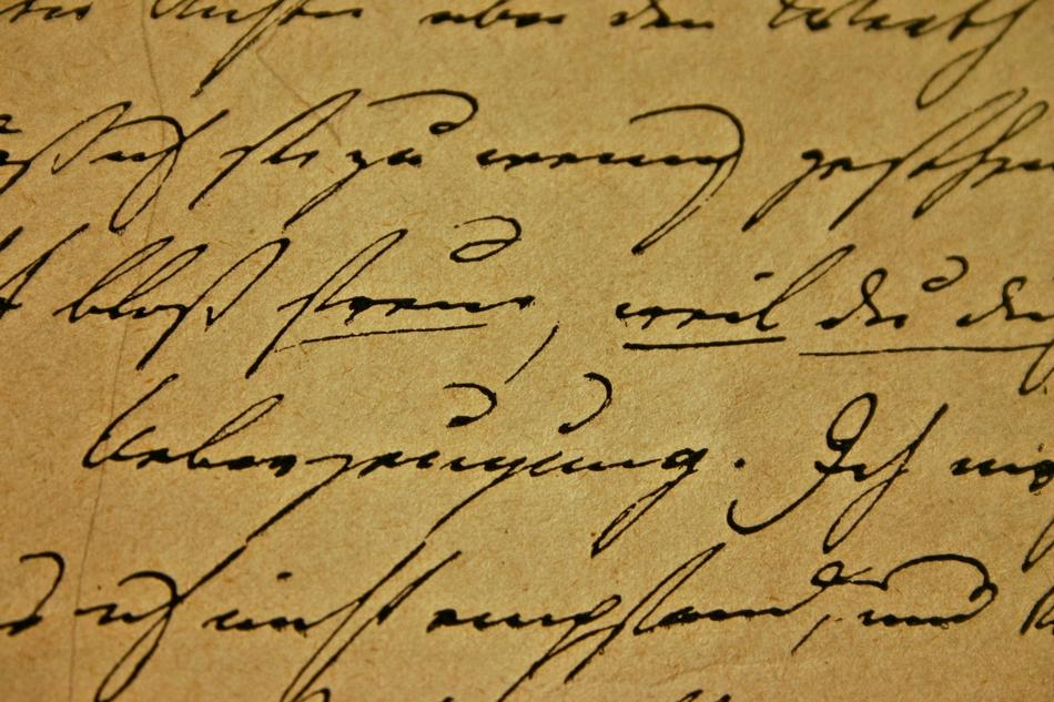 italic handwriting in a book