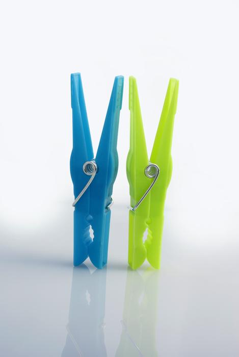 colored clothespins on a white background
