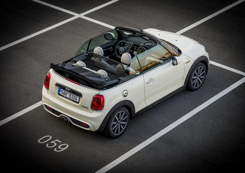 white car with people in the parking lot
