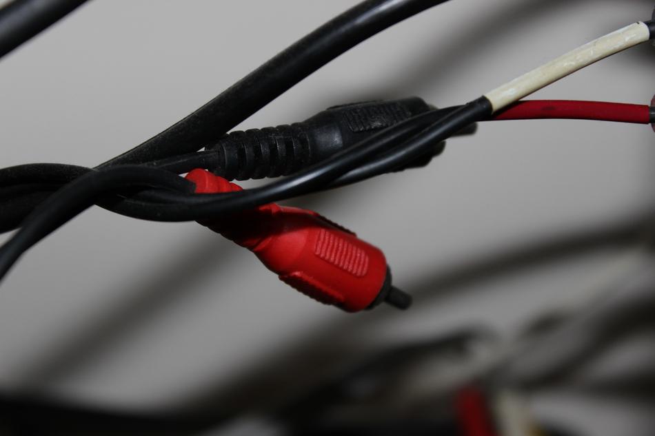Close-up of the shiny, black and red cable, with the cable termination