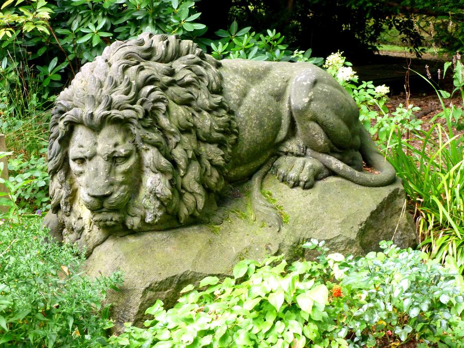 Stone figure of lion in the garden