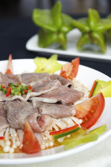 Meat dish garnished with vegetables