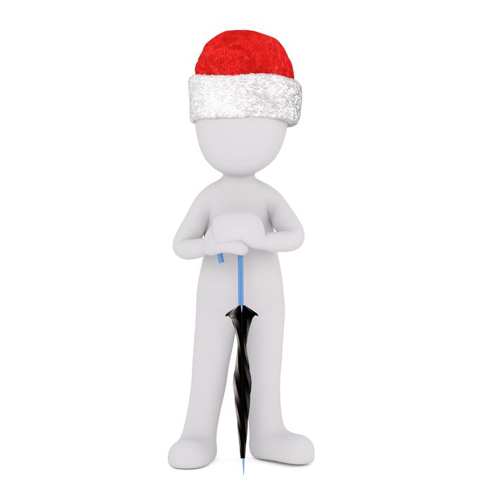 Model of a man with an umbrella and a hat on his head