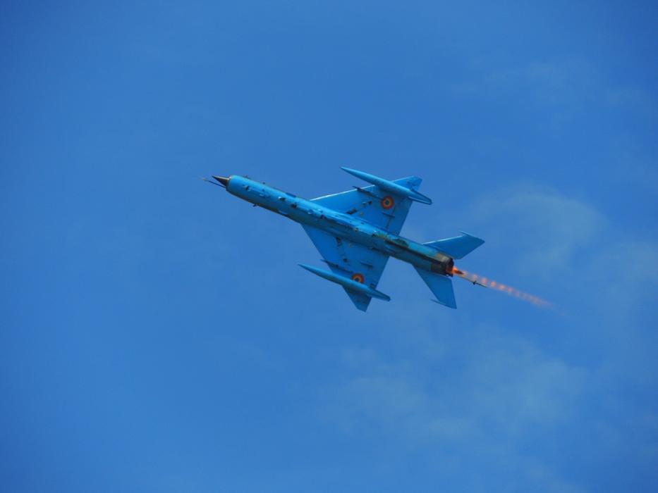 blue military plane in the sky