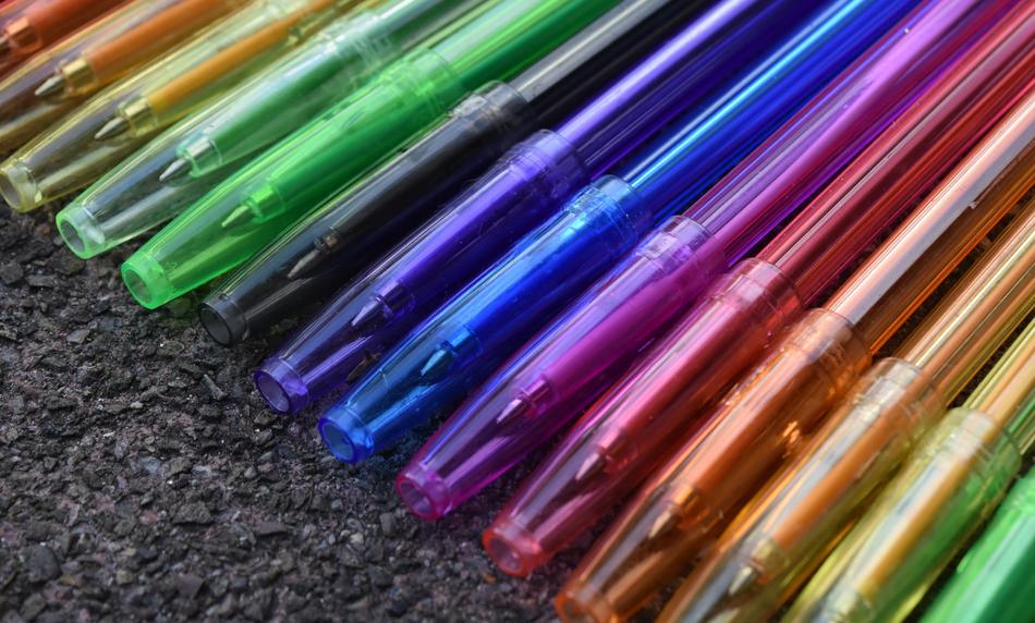 colored pens on the ground