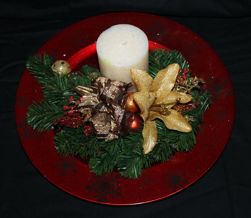 white Christmas candle on a plate