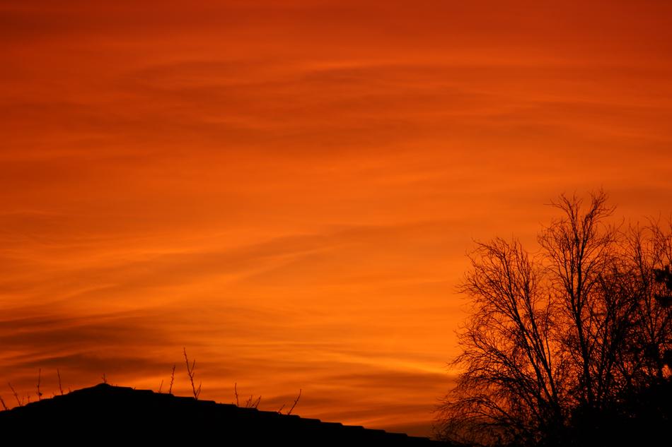 silhouette of a mountain on an orange background