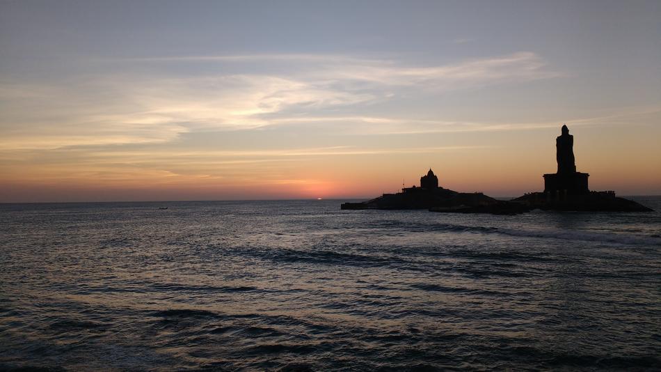 old lighthouse in the center of the sea