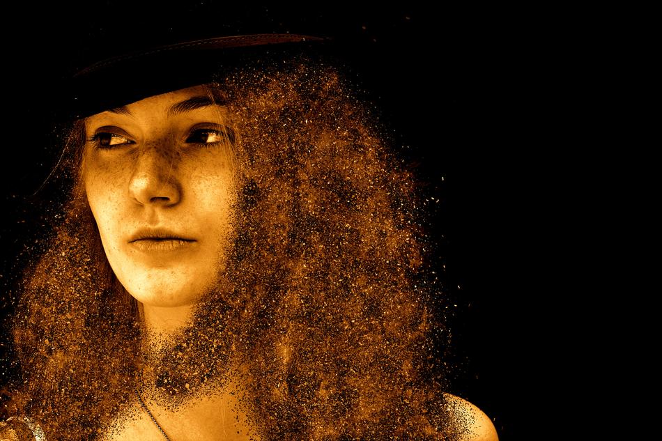 Portrait of a girl with freckles and red hair