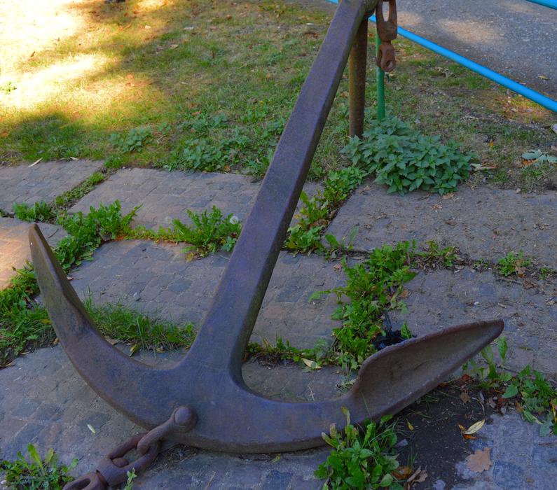 an old anchor on a stone floor