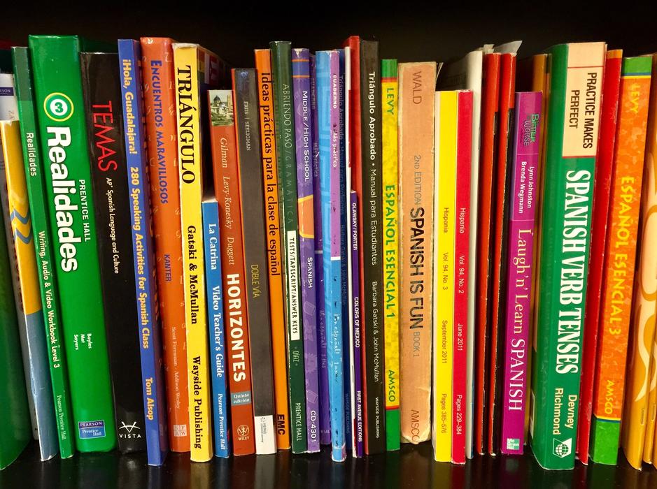 Close-up of the colorful books, with the signs, on the Bookshelf