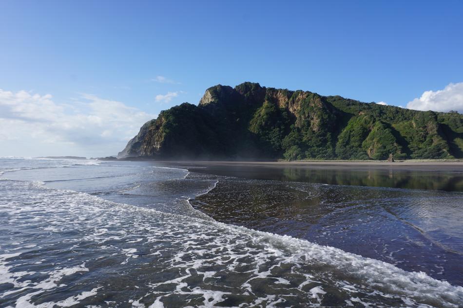 seashore with mountains
