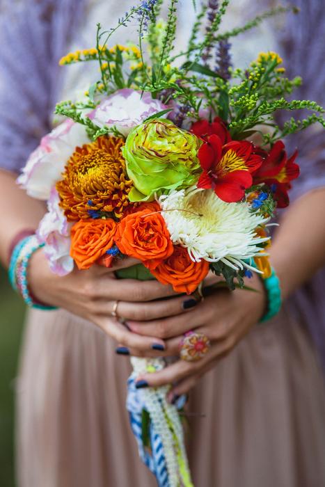 colored bouquet in hand