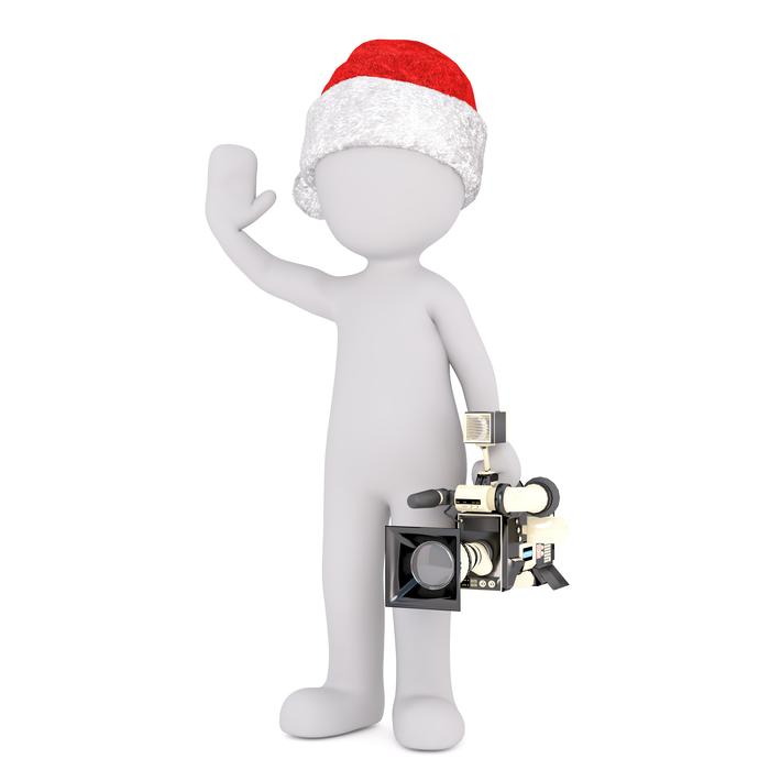 white model of a man in a hat and with a video camera