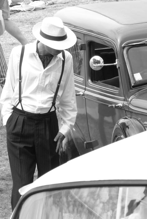 retro photo of a man with a car