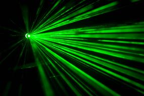 green rays on a black background