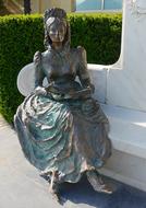 sitting iron statue of a girl
