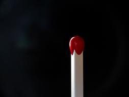 red match in the dark