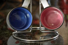 colored ceramic mugs on the table