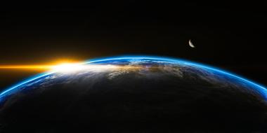 rising sun over the planet earth