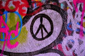 peace sign on colored graffiti