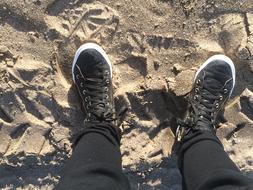leather shoes on sand