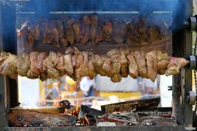 hot roast meat with spices on the fire